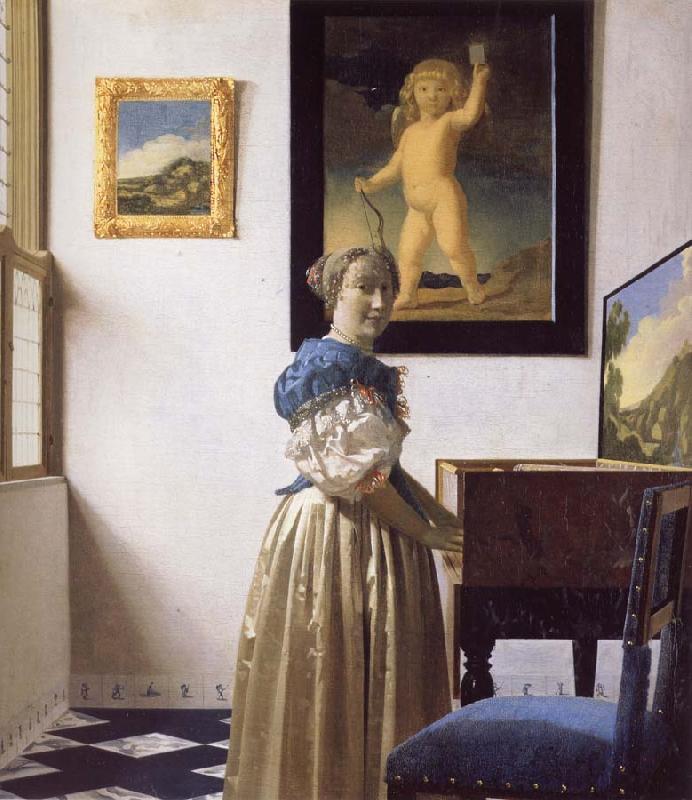 JanVermeer A Young Woman Standing at a Virginal oil painting image